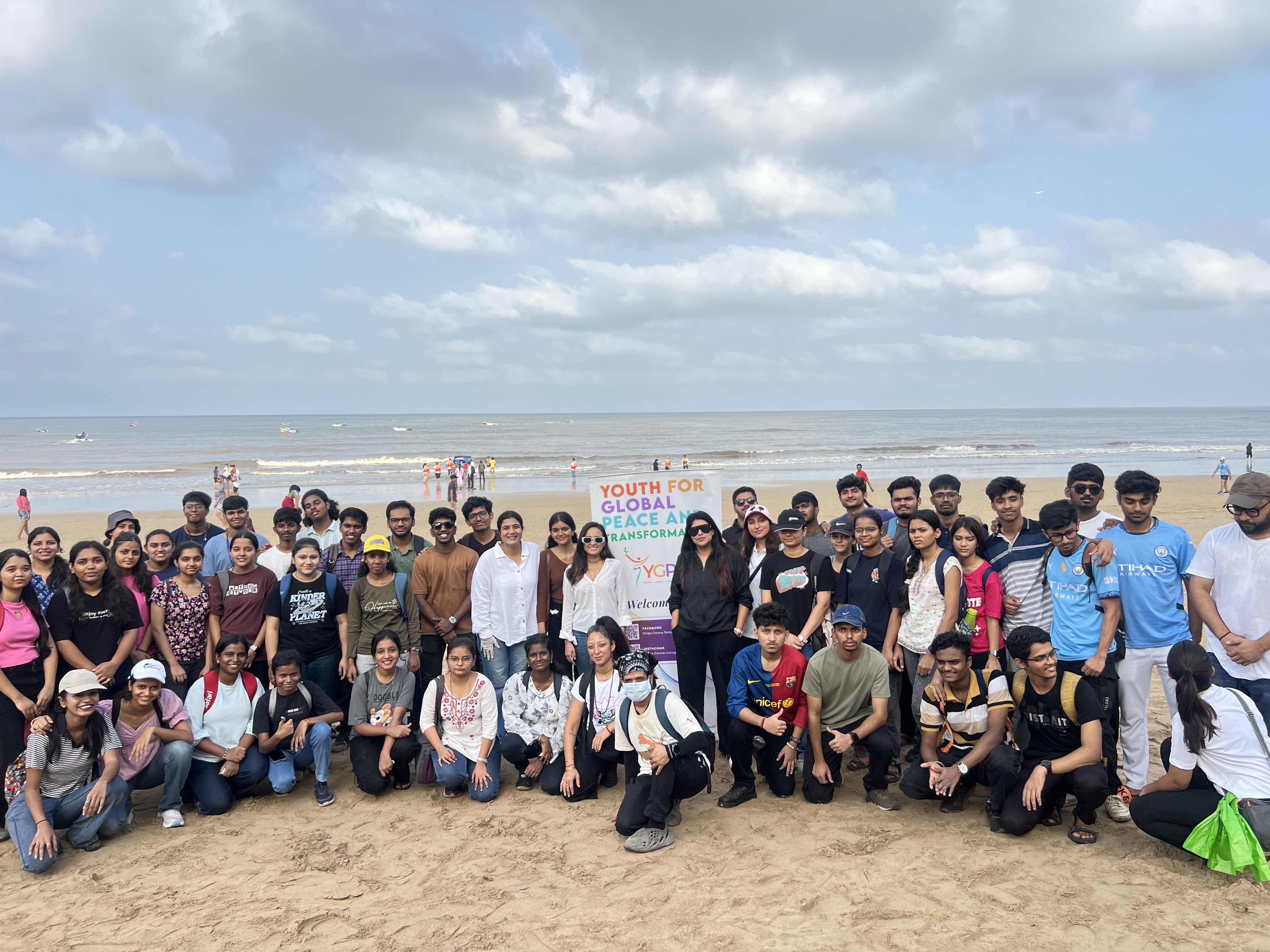 YGPT youth volunteers at a beach cleanup — Youth for Global Peace and Transformation